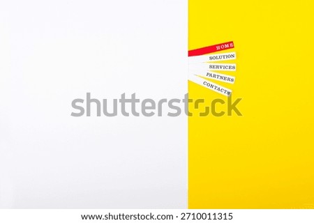 Creative display of business navigation tabs on yellow background showcasing home, solution, services, partners, and contacts