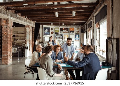 Creative diverse team collaborating in modern open office space - Powered by Shutterstock