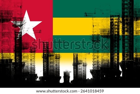 Creative double exposure holographic image of unfinished super high-rise building and Togolese flag. Depicts real estate crash, rising prices, financial turmoil and inflation
