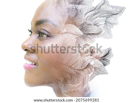 A creative double exposure portrait of a woman combined with ink leaves. Paintography.