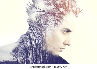 Creative Double Exposure Portrait Of Young Man Combined With Photograph Of Nature