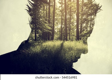 Creative Double Exposure Portrait Of Young Man Combined With Photograph Of Nature