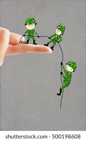 Creative Drawing Of Small Soldiers On Real Human Hand Helping Each Other Descend Down A Finger Using A Rope