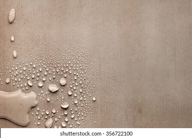 Creative Drops Of Water On Piece Of Carton Paper