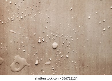 Creative Drops Of Water On Piece Of Carton Paper