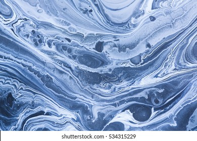 Creative ebru background with abstract acrylic painted waves. Beautiful marbling texture. Handmade marble surface. Blue and yellow colors.