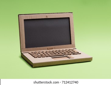 Creative eco-friendly laptop with black screen made from recycled cardboard: creativity, crafts and ecology concept