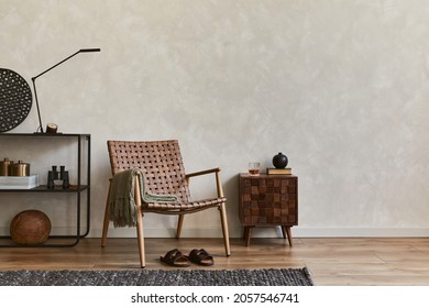 Creative Elegant Composition Of Masculine Living Room Interior Design With Copy Space, Brown Armchair, Designed Commode, Industrial Shelf And Personal Accessories. Template.  