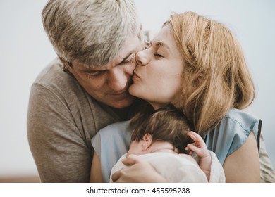 Creative  Family Doing A Photo Shoot In The Bedroom