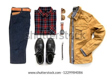 Creative fashion design for men casual clothing set with black boot , watch, blue jeans, belt, wallet, sunglasses, office shirt, yellow jacket and bracelet isolated on a white background, Top view