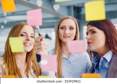 Creative Female Team At Office Working On New Strategy