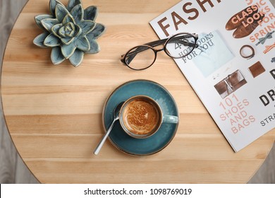 Creative flat lay composition with delicious hot coffee on table