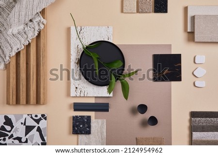 Creative flat lay composition of interior designer and architect moodboard. Textile and paint samples, lamella panels and lastrico tiles. Beige, black and green color palette. Copy space. Template. 