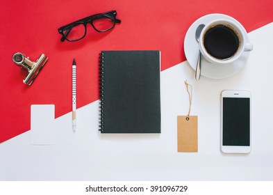 Creative flat lay photo of workspace desk with smartphone, eyeglasses, coffee, tag and notebook with copy space background, minimal styled
 - Powered by Shutterstock