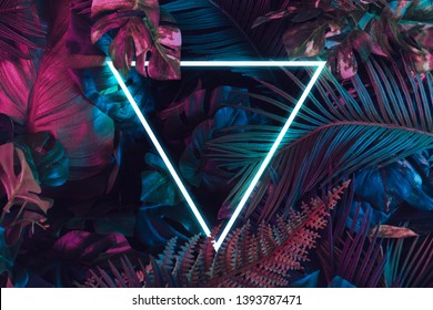 Creative fluorescent color layout made of tropical leaves. Flat lay neon colors. Nature concept. - Shutterstock ID 1393787471