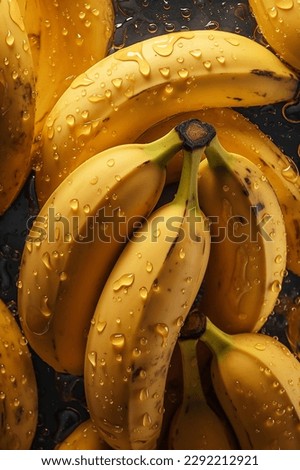 Creative food concept. Fresh yellow banana bananas adorned with glistening water droplets seamless. mock up. view. top. flat lay	
