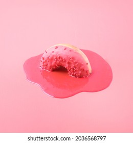 Creative Food Concept. Pink Donut Melts On A Pink Background.

