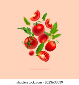 Creative food concept. Tomatoes pattern. Flying red ripe juicy tomatoes and green leaves on pink background. Healthy vegan organic food, vegetable, cherry tomatoes, summer, harvesting 