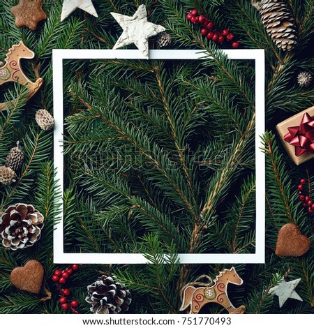Creative frame of Christmas tree branches and decorations with space for text. Top view. Xmas and New year concept