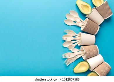 Creative frame of new Biodegradable Single-Use Cutlery. Bioplastic - Great alternative to plastic disposable tableware isolated on blue background, copy space