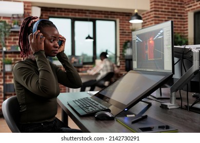 Creative game developer following CGI render on computer screen while analyzing engine capabilities. Digital entertainment industry employee looking up for graphical artifacts.