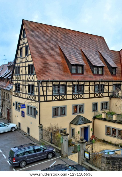 Creative
German hotel. The Prinzhotel Rothenburg. Ancient buildings with
tile roofs in unique medieval old town in Bavaria. Germany.
Rothenburg ob der Tauber  – November 22,
2017