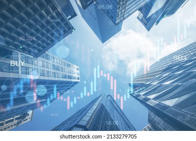Creative glowing candlestick forex chart on blurry city backdrop. Finance growth and trade concept. Double exposure