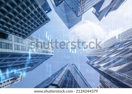Creative glowing forex chart grid and big data hologram on blurry city background. Trade, technology and finance concept. Double exposure