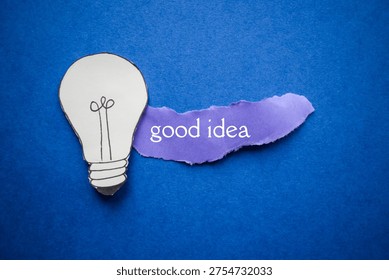 Creative Good Idea Concept with Lightbulb and Purple Paper