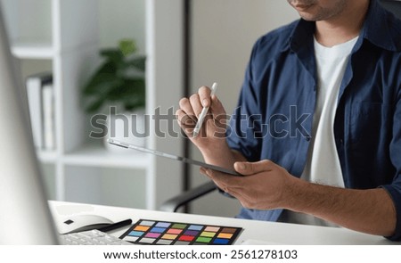 Creative Graphic Designer Selecting Colors for Innovative Digital Design Projects