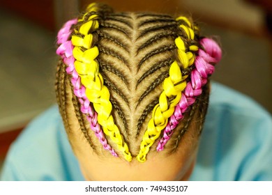 creative hairstyle of thin and thick plaits with interweaving neon hair kanekalon