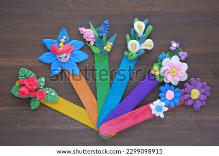 Creative handmade bookmarks made from jumping clay and ice cream stick. 
