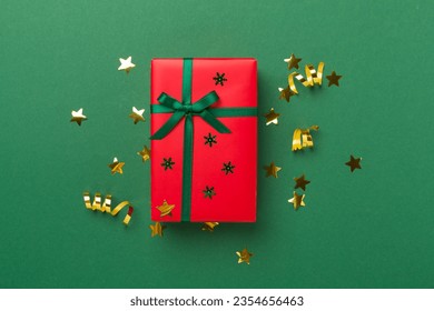 Creative handmade christmas gift box with decor on color background, top view
