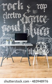 Creative Home Office With Chalkboard Wall, Simple Desk. Computer And White Crystal Chair