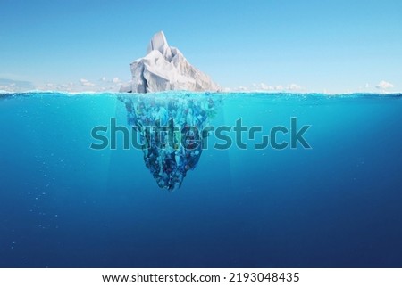 Creative iceberg floating in the ocean with garbage plastic bottles underwater. Global warming and pollution, a concept. Pollution of water and oceans