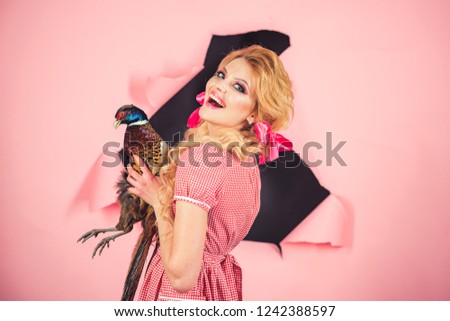 Creative idea. Bird flu. Funny advertising. retro happy woman hold pheasant. Halloween holidays and dolls. Crazy girl on pink. Halloween. vintage woman with poultry meat. So much fun. Going crazy.