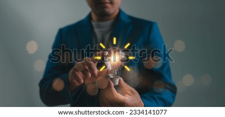 Creative idea. Concept of idea and innovation, Businessman holding light bulb. Idea concept with innovation and inspiration for business or education, Creative thinking and learning.