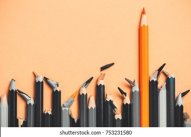 creative idea, concept of leadership, competition in business, leader among people with broken core, losers; success in comparison with defeat, colored pencil among black and white - Shutterstock ID 753231580