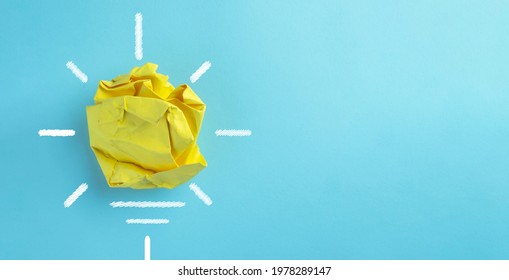 Creative idea concept.,light yellow bulb made by paper over blue sky background with copyspace use for innovation,creativity,inspiration,solution,success concept.