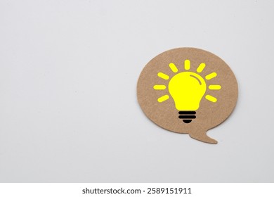 Creative Idea Concept.,Speech Bubble with Light Bulb Icon Representing Brainstorming, Innovation, Communication, and Knowledge Sharing in Business and Education.