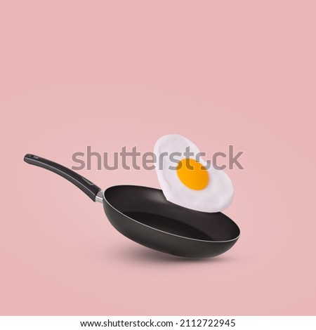 Creative idea with a frying pan and a flying fried egg in heart shape on a bright pink background. Minimal food and love concept. Breakfast idea for Valentine's day and romantic morning. Copy space.