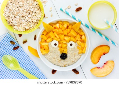 Creative idea for kids breakfast oatmeal healthy bowl with fruit shaped funny fox