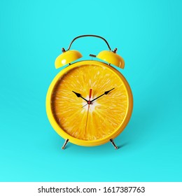 Creative idea layout fresh orange slice alarm clock on blue background. minimal idea business concept. Healthy lifestyle concept