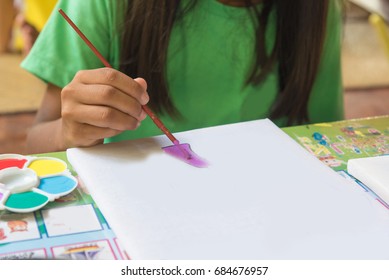 Creative ideas and learning. Education concept. Child's hands drawing. Colorful picture made by kids. 