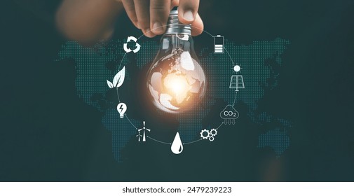 Creative ideas of saving energy and renewable power concept, Hand holding light bulb with icons energy sources for renewable, New ideas for energy management. Alternative energy.