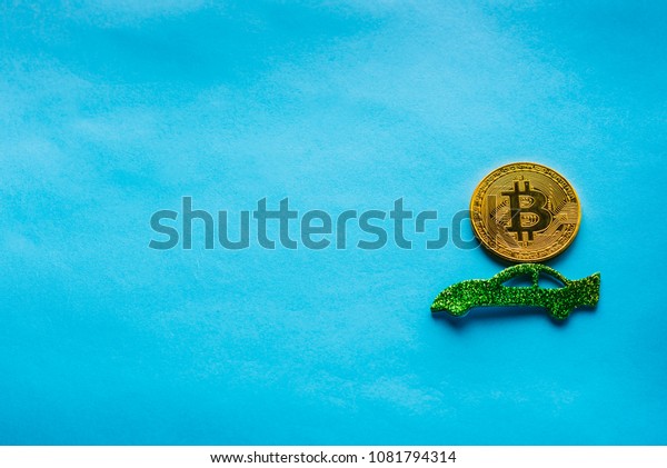 Creative image for articles: travel with\
bitcoin, Bitcoin\'s – International Trade Concept. Cryptocurrency on\
green car, blue background.Copy space for\
text.