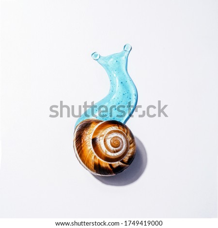 Creative image of cosmetics with snail mucus. Art Concept of Natural Respectful Facial and Body Care with Snail Slime