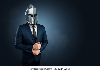 Creative image, a man in a modern suit of a businessman, a knight's helmet on his head, armor. The concept of a modern hero, overcoming difficulties, a crisis, a good manager. magazine style.