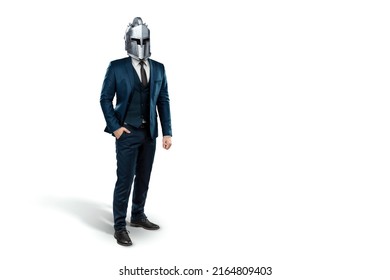 Creative image, a man in a suit of a businessman, a knight's helmet on his head on a white background. The concept of a modern hero, overcoming difficulties, crisis management. magazine style.
