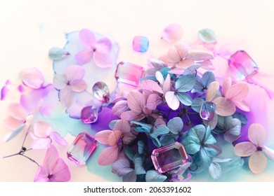 Creative Image Of Pink And Purple Hydrangea Flowers On Artistic Ink Background. Top View With Copy Space